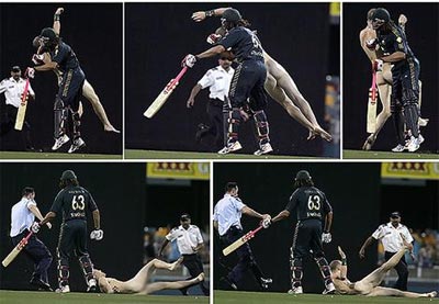 Andrew Symonds knocks over the streaker