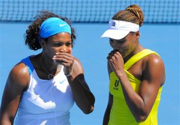 The Williams sisters giggle at the streaker