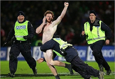 Streaker on a mobile phone.